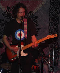 Frank Byrne playing guitar